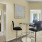 a room with a table chairs and a mirror