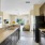 a kitchen with a black refrigerator
