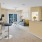 a large living room with access to the kitchen