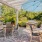 a patio with tables and chairs