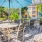 a patio with tables and chairs