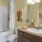 a bathroom with a tub sink and toilet