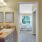 a bathroom with a sink and a bed