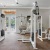 spacious fitness center with lots of windows